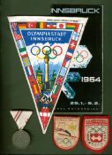 Innsbruck 1964 Winter Olympic Games memorabilia, comprising: an Austrian medal, two cloth badges,
