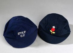 Two cricket caps, the first with a red rose to the crown, the other inscribed St. H.P. C.C.