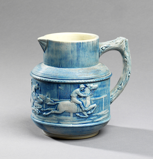 A rare German stoneware jug depicting a horse racing scene, late 19th century, blue/grey