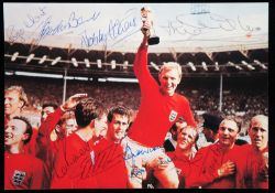 A signed colour photograph of the England 1966 World Cup winning team, signatures in blue pen, 15 by