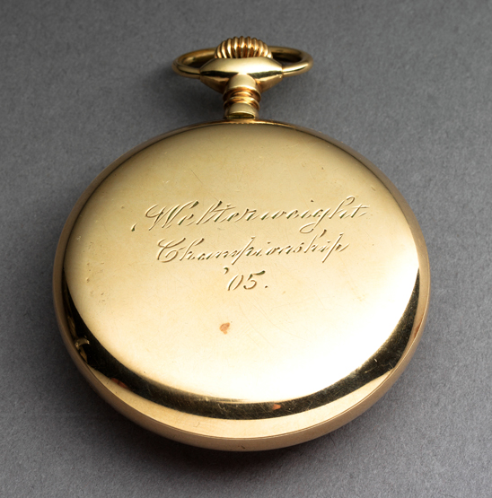 An Elgin National Watch Co. gold-plated size 16 open faced boxing pocket watch with an engraving