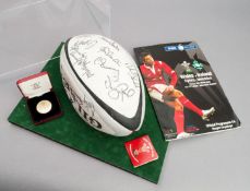 A rugby ball signed by the Wales squad prior to the Grand Slam match v Ireland at the Millennium