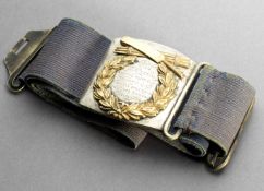 A Victorian presentation cricket belt, in the form of a rounded square white silver plated buckle