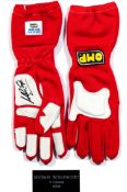 Michael Schumacher-signed gloves display, the left-hand synthetic leather double palm bearing his