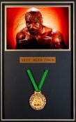 A signed "Iron" Mike Tyson framed display, a 16 by 12in. colour photograph signed by Tyson in
