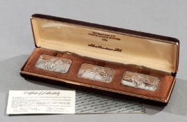 A cased set of three silver ingots commemorating the winning of the Triple Crown in 1973 by