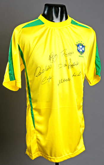 A signed Brazil replica jersey, 8 signatures in black marker pen comprising Roque Junior, Rivaldo,