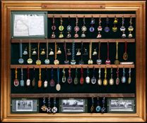 A Kempton Park member`s race badges display, a custom made board for displaying a run of badges from