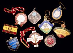 An assortment of 20 member`s badges for overseas racecourses dating between the 1950s and 1970s,