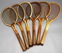 Six convex throat tennis racquets, i) "Grosvenor" circa 1910 by an unknown maker with a prancing