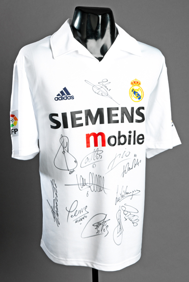 A team-signed Real Madrid replica jersey season 2002-03, 12 signatures in black marker pen including