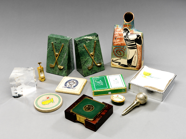 A miscellany of modern golf collectibles, table mats & coasters, paperweights, bottles, enamel