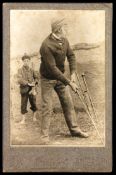 A cabinet card of a golfer, with a young caddie beyond, published in Glasgow