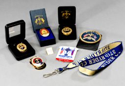 Six official Ryder Cup badges, a 1971 plastic official’s badge, brooch fitting; a gilt metal thread,