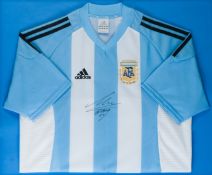 A Maradona signed blue & white striped Argentina replica jersey, signed centrally in black marker