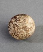 A hand hammered gutty ball circa 1860s, in reasonable condition, other than approx. 40 per cent