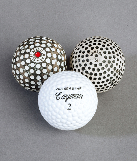 A miscellany of 18 golf balls, mostly rubber-core mesh patterns, but the lot including a Capon