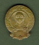 A Stockholm 1912 Olympic Games official`s badge, in bronze, repair to pin to the reverse, 45 by 39mm