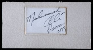 A Muhammad Ali cut signature dated 1973, in fine felt tip pen, inscribed `Peace` and dated 1973,