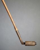 An unusual roller putter, by an unknown maker, hickory shafted; sold together with 17 other