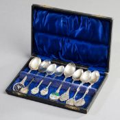 Eight EPNS lawn tennis spoons, including 1 matching pair, housed in a purpose made case