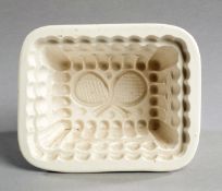 A Victorian pottery jelly mould by W T Copeland, Stoke-on-Trent, with a tennis design, incorporating