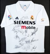 A team-signed Real Madrid replica home jersey from the 2002 centenary season, 14 signatures in black