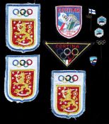 Five Olympic pins relating to the 1956 Winter Olympic Games at Cortina, two with Olympic Rings and