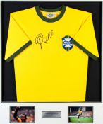 A Pele signed Brazil retro jersey, signed in black marker pen, mounted with two colour photographs