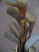 F G Smith model putting cleek, together with a `Bogee` putter, 5 irons and 2 putters, all hickory