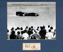 Malcolm Campbell autograph display, comprising a 7 1/2 by 5 1/2 in. black & white reproduction photo