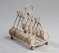 A silver plated tennis theme toast rack circa 1900, designed 14 crossed lawn tennis rackets on