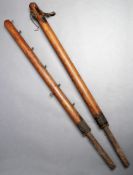 A fine pair of `Gardiner`s Club Lawn Tennis Poles` made at Hoddesdon, Hertfordshire and with a