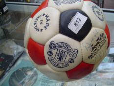 A football signed by the Manchester United squad circa 1977, Buchan, McIlroy, Greenhoff, Roche,