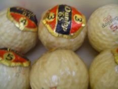Three boxes of wrapped golf balls, 12 x Dunlop 65, 6 x Dunlop 65, 3 x Penfold