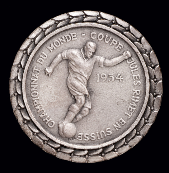 A silver plated 1954 World Cup participation medal, inscribed CHAMPIONNAT DU MONDE-COUPE JULES RIMET