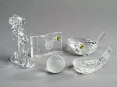 Five golfing items of Waterford Crystal, two models of clubheads, a model of a ball, a figurine, and