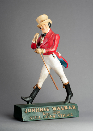 A very rare & large Johnnie Walker whisky advertisement figure carrying a long nosed club, 74cm.,