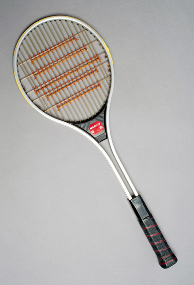 A Fischer `Mark 77` "spaghetti" racquet dating from 1977, the double gut strung racquet, most
