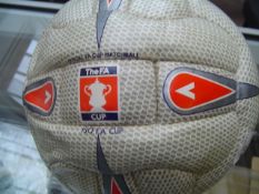 An official F.A. Cup football match ball used in a tie involving Swansea City and signed by Lee