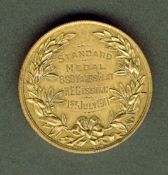 A medal awarded to the American athlete Harry E. Gissing at the British Athletics Championship at