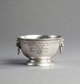 A silver tennis trophy, in the form of a lightly hammered bowl hallmarked London, 1922, drop handles