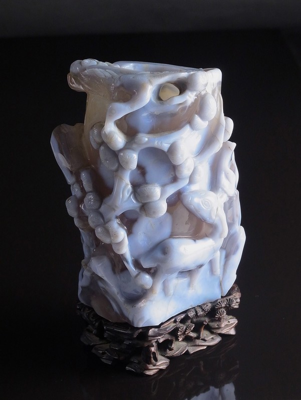 A Chinese carved agate tree trunk vase. Qing dynasty, probably 18th century. Deeply carved in the