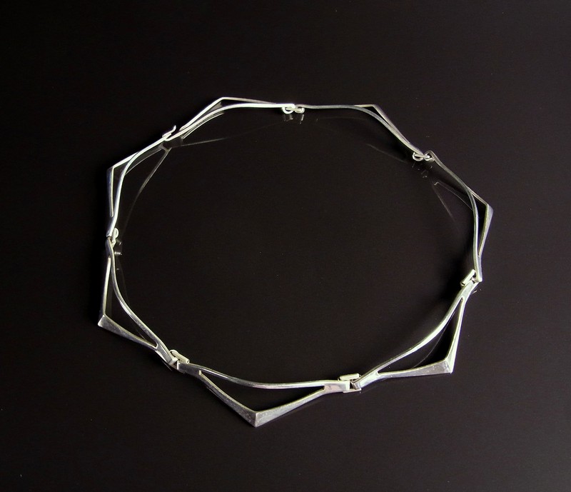 Norwegian Plus Design sterling silver articulated necklace. Comprising seven triangular links.