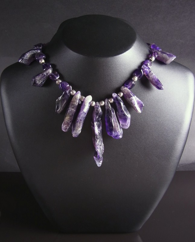 Sterling silver amethyst necklace. Comprising various tumbled shards of amethyst alternating with