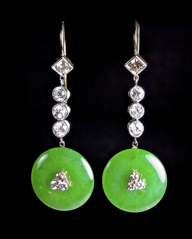 Yellow and white gold jade and diamond ear pendants. Each pendant fashioned as a green jade disc set