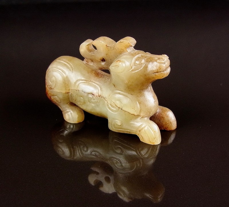 A Chinese jade carving of deer. Possibly Shang dynasty period or later. Carved in a recumbent