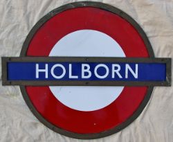 London Transport Underground Station Target in shaped bronze frame HOLBORN. Three separate enamel
