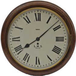 BR(M) Oak cased dial clock, with a Smiths going barrel platform escapement movement  circa 1957. The