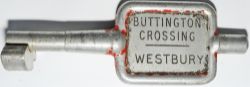 Single Line Alloy Key Token BUTTINGTON CROSSING - WESTBURY. Ex L&NWR and GWR joint line between